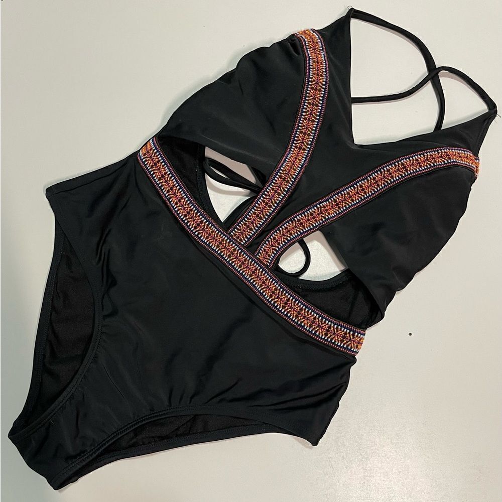 Women’s one piece Black with ornate ribbon.